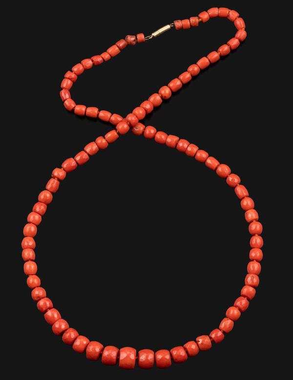 Graduated coral beads and gold necklace