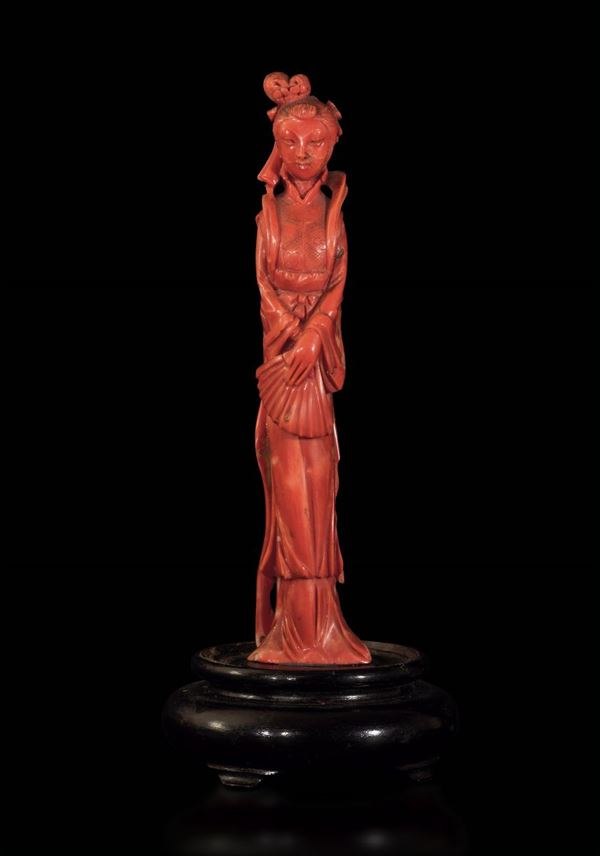 A carved coral figurine, China, early 1900s