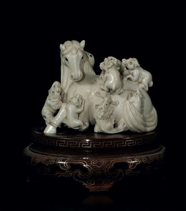 A carved ivory group, China, early 20th century