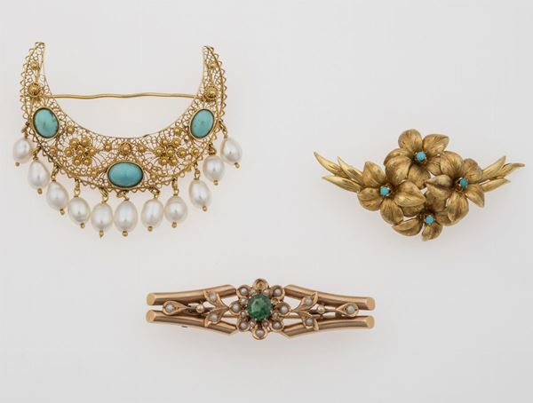 Three gold brooches