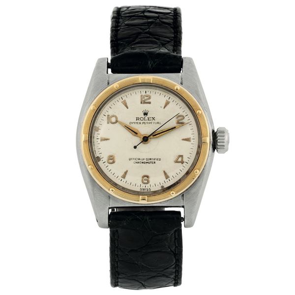 Rolex, Oyster Perpetual, Officially Certified Chronometer, BUBBLE BACK, Ref. 2940. Fine, tonneau-shaped, center seconds, self-winding, water resistant, stainless steel and yellow gold wristwatch with original buckle. Made in the 1940's.