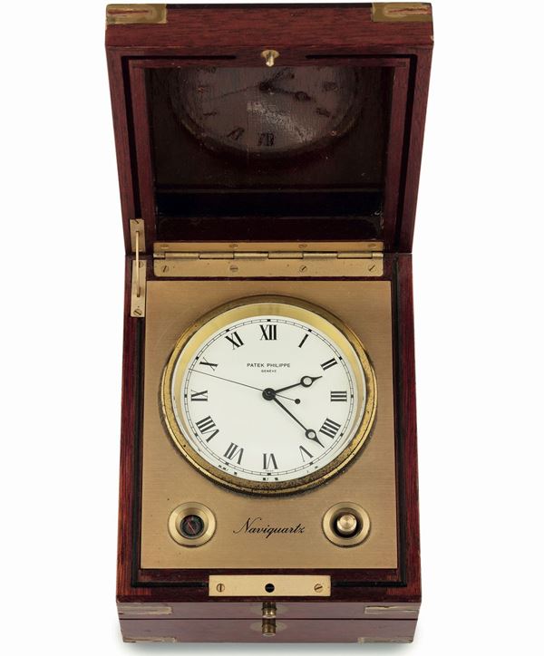 Patek Philippe, Naviquartz, Ref.1215, Mahogany and gilted brass quartz, rectangular-shaped, centre-seconds marine chronometer with stop-feature and battery power-reserve indication.
