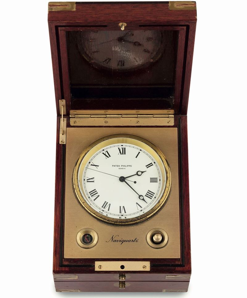 Patek Philippe, Naviquartz, Ref.1215, Mahogany and gilted brass quartz, rectangular-shaped, centre-seconds marine chronometer with stop-feature and battery power-reserve indication.  - Auction wrist and pocket watches - Cambi Casa d'Aste