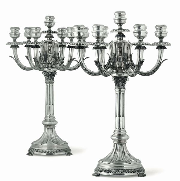 Monumentale coppia di candelabri in argento fuso, sbalzato e cesellato. Firenze, seconda metà del XX  [..]