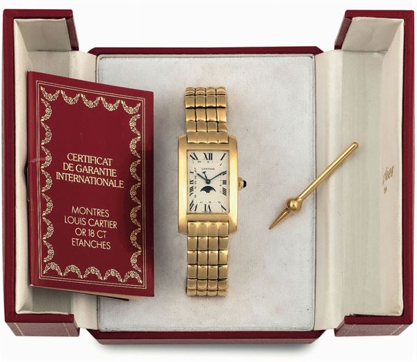 CARTIER, Tank Americaine, Moon Phases, case No. 000118. Fine, water resistant, 18K yellow gold quartz wristwatch with moon phases and gold original bracelet with deployant clasp. Accompanied by the original box, Guarantee,  booklet and push pin. Made circa 1990