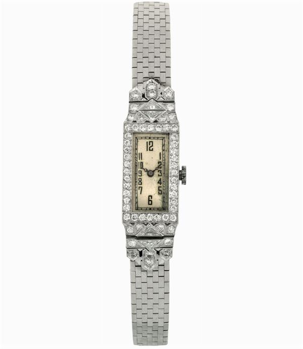 Unsigned. Fine, 14K gold and diamonds  lady's wristwatch with gold integrated bracelet. Made circa 1920