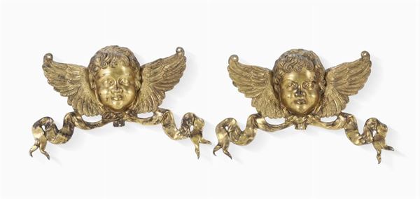 Coppia di teste di cherubino in bronzo fuso, cesellato e dorato, Italia XVII-XVIII secolo