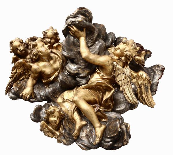 Gruppo ligneo con angeli e cherubini. Legno dorato e argentato. Arte romana del XVII secolo di influenza algardiana