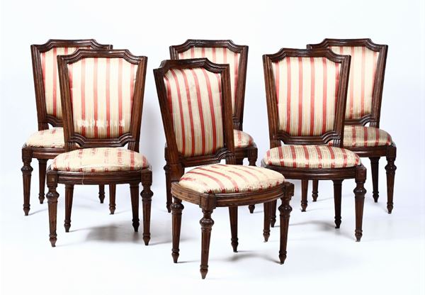 Sei sedie Luigi XVI in noce intagliato, fine XVIII secolo