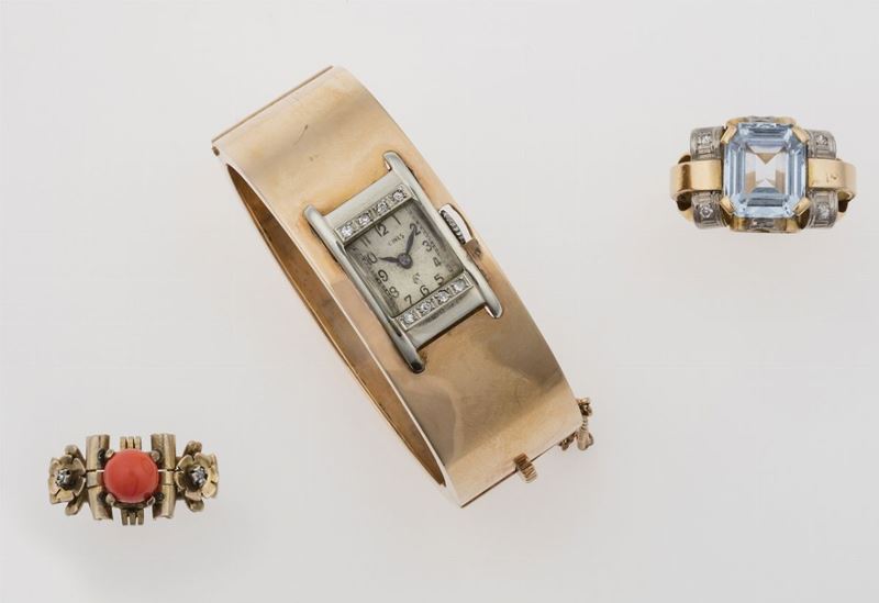 Lotto composto da due anelli ed un bracciale rigido con orologio  - Asta Asta a tempo Gioielli - Cambi Casa d'Aste