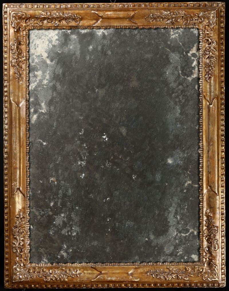 Specchiera in legno intagliato e dorato a mecca, XVIII secolo  - Asta Antiquariato e dipinti  IV | Asta a Tempo - Cambi Casa d'Aste