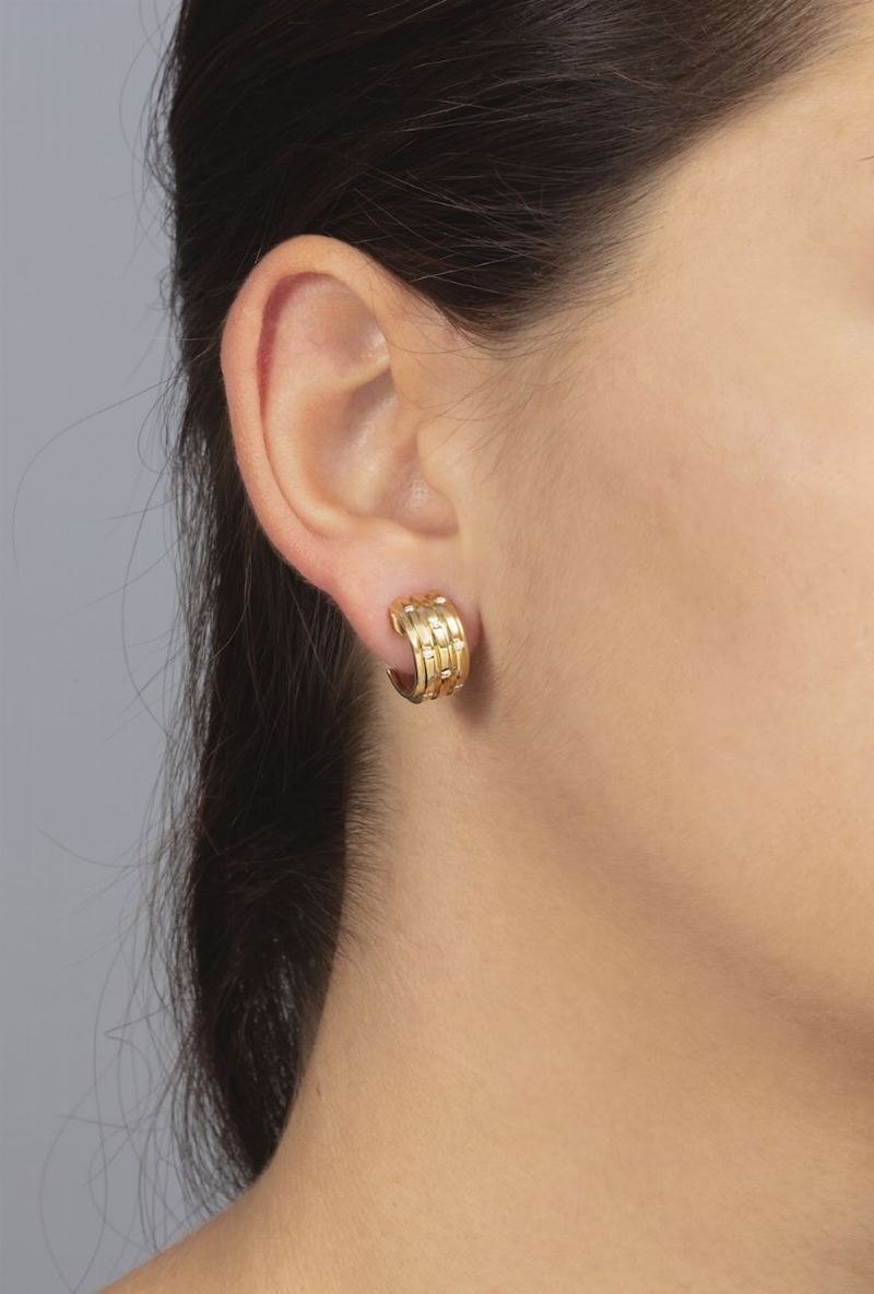 Pair of diamond and gold earrings. Signed Piaget  - Auction 100 designer jewels - Cambi Casa d'Aste