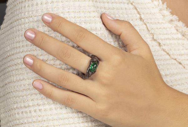 Emerald and low carat gold ring