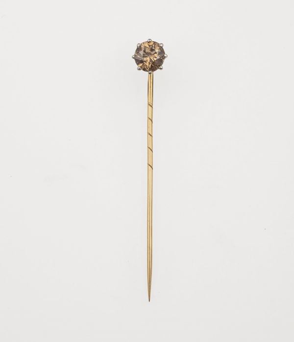 Brown diamond and gold tie pin