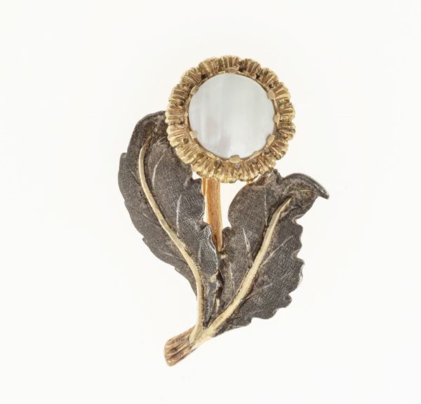 Mother of pearl, gold and silver brooch. Signed M. Buccellati