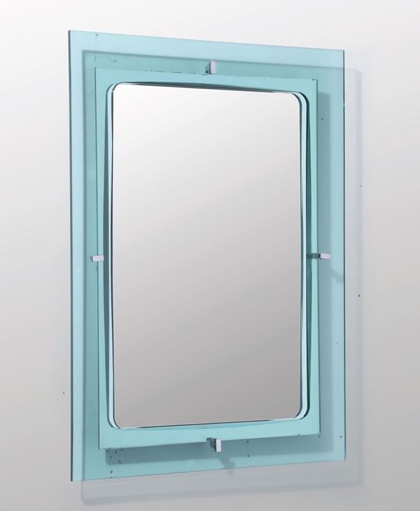 Specchio da parete con profilo in vetro colorato, molato e vetro specchiato particolari in ottone nichelato.