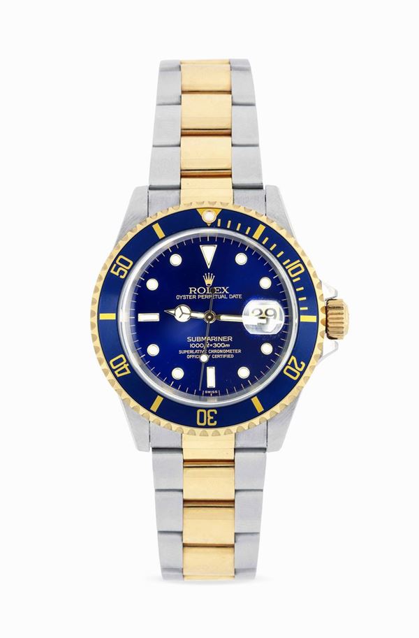 ROLEX - Stainless steel and yellow gold Submariner date 16613 wristwatch with blue dial. Fitted with  [..]