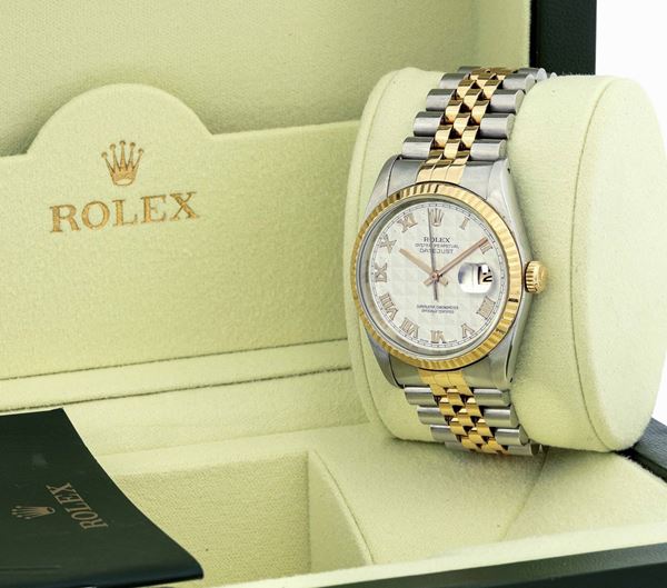 ROLEX - Stainless steel and yellow gold Datejust, date at 3 o'clock, roman numbers. Original box fitted and warranty.
