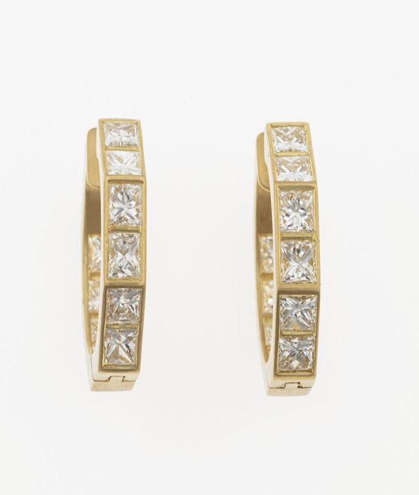 Pair of diamond and gold earrings. Signed Enrico Cirio