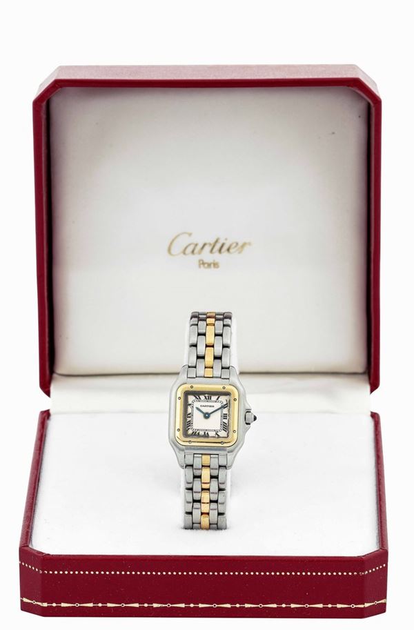 CARTIER - Stainless steel and yellow gold Santos wristwatch with roman numbers. Equipped with original box.