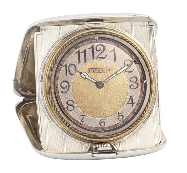 TIFFANY & CO. - Silver table clock with oyster-shape.