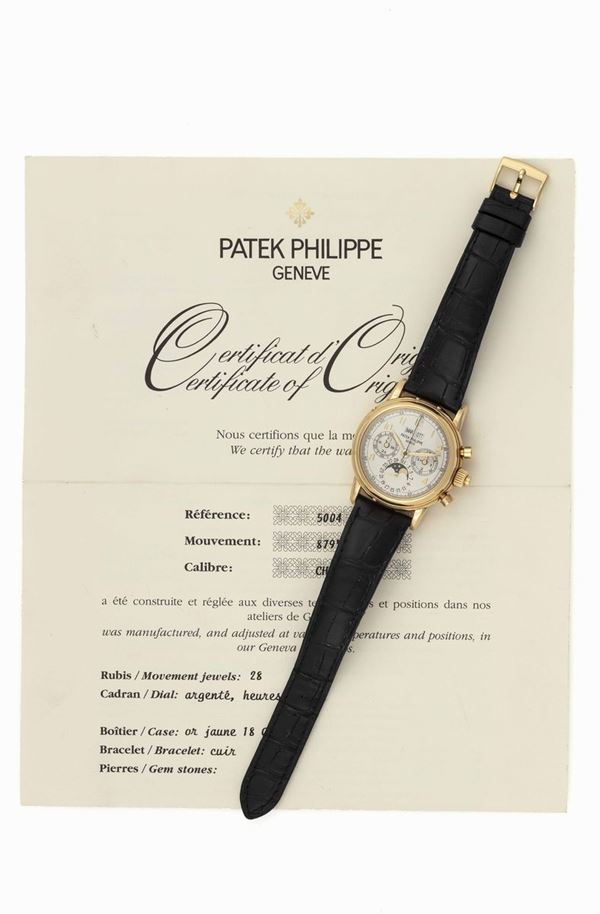 PATEK PHILIPPE - 5004 Yellow gold Chronograph Rattrappante wristwatch with perpetual calendar, moon phases and leap year indicator. Original box, warranty and extract of origin from Patek Philippe.