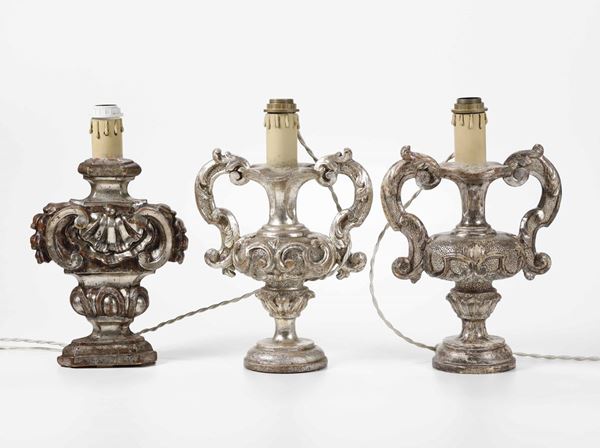 Tre lampade in legno intagliato e argentato, XVIII secolo
