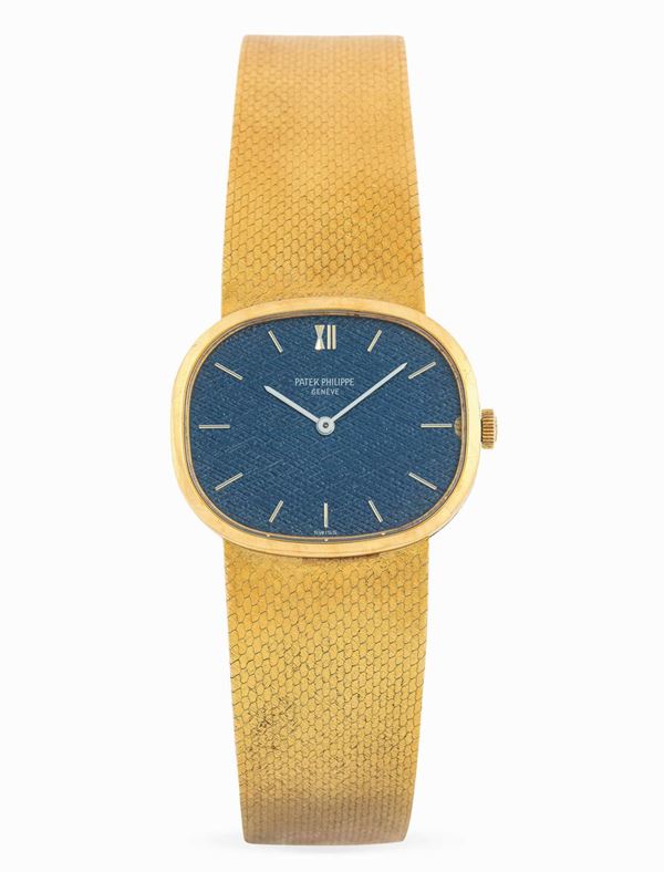 PATEK PHILIPPE - Elegante orologio da polso in oro giallo con quadrante blu.