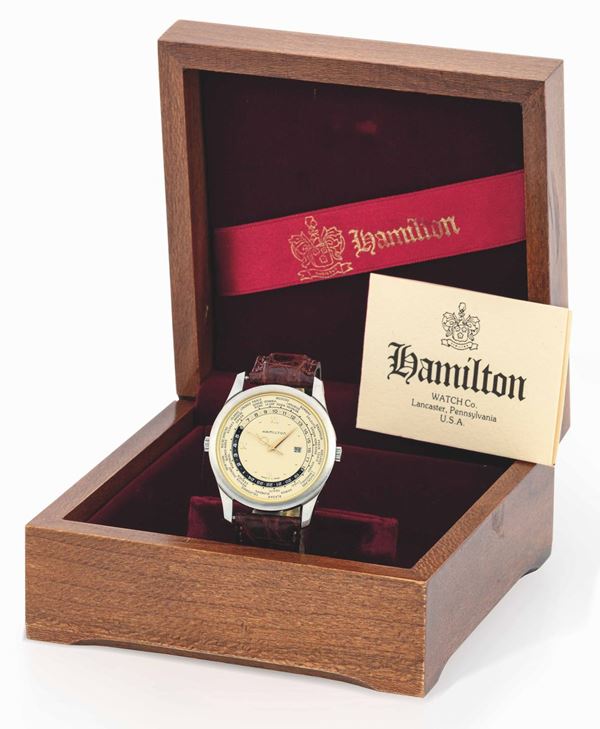 HAMILTON - Stainless steel wristwatch, date at 3 o'clock, universal hours. Fitted with original box and guarantee.