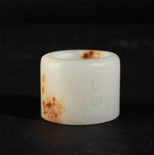 A jade and russet archer ring, China, 1900s