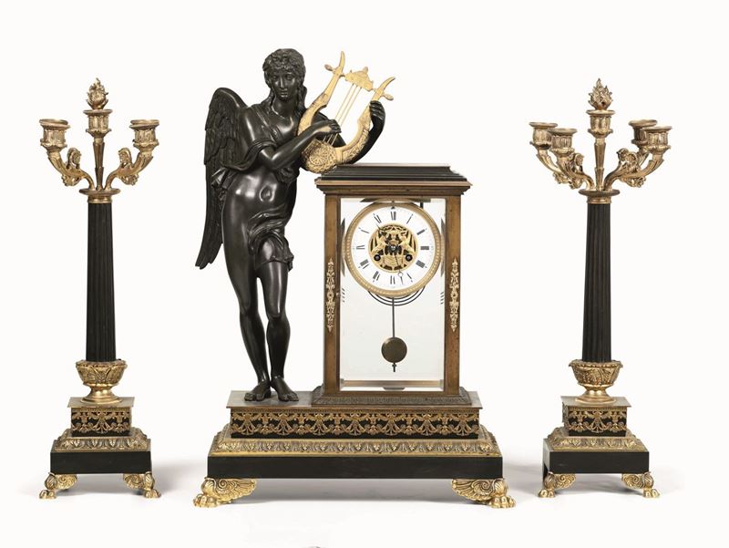 Trittico da camino composto da pendola e coppia di candelabri in bronzo dorato e patinato, XIX secolo  - Auction Antiques - Time Auction - Cambi Casa d'Aste