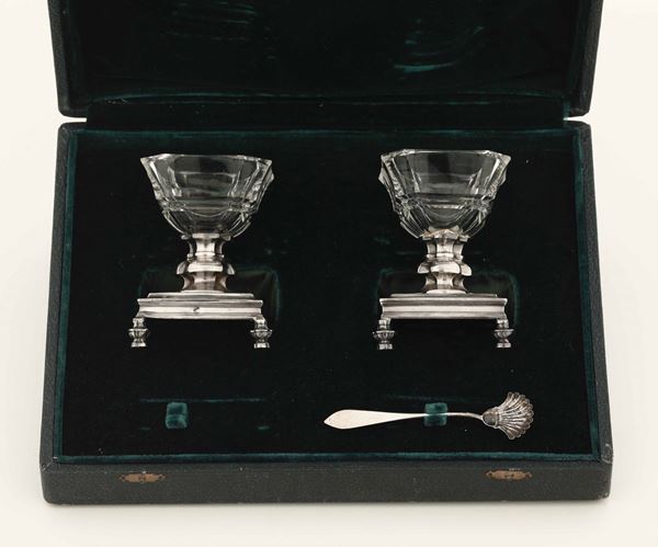 Two silver salt cellars in a case, France