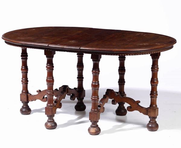 Tavolo ovale in legno con montanti a rocchetto, XIX secolo