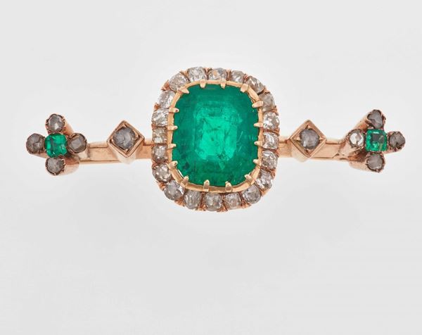 Emerald and gold brooch; accompanied by gemological report