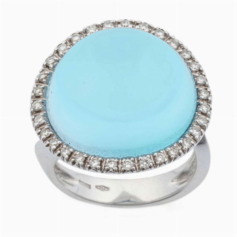 Anello con topazio azzurro taglio cabochon e diamanti a contorno  - Asta Gioielli | Cambi Time - Cambi Casa d'Aste