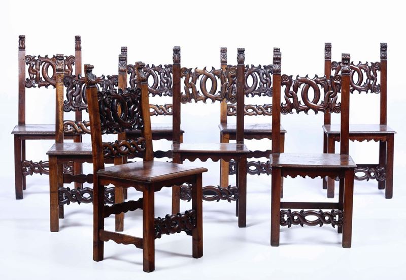 Otto sedie in noce intagliato, XIX secolo  - Asta Arredi | Cambi Time - Cambi Casa d'Aste