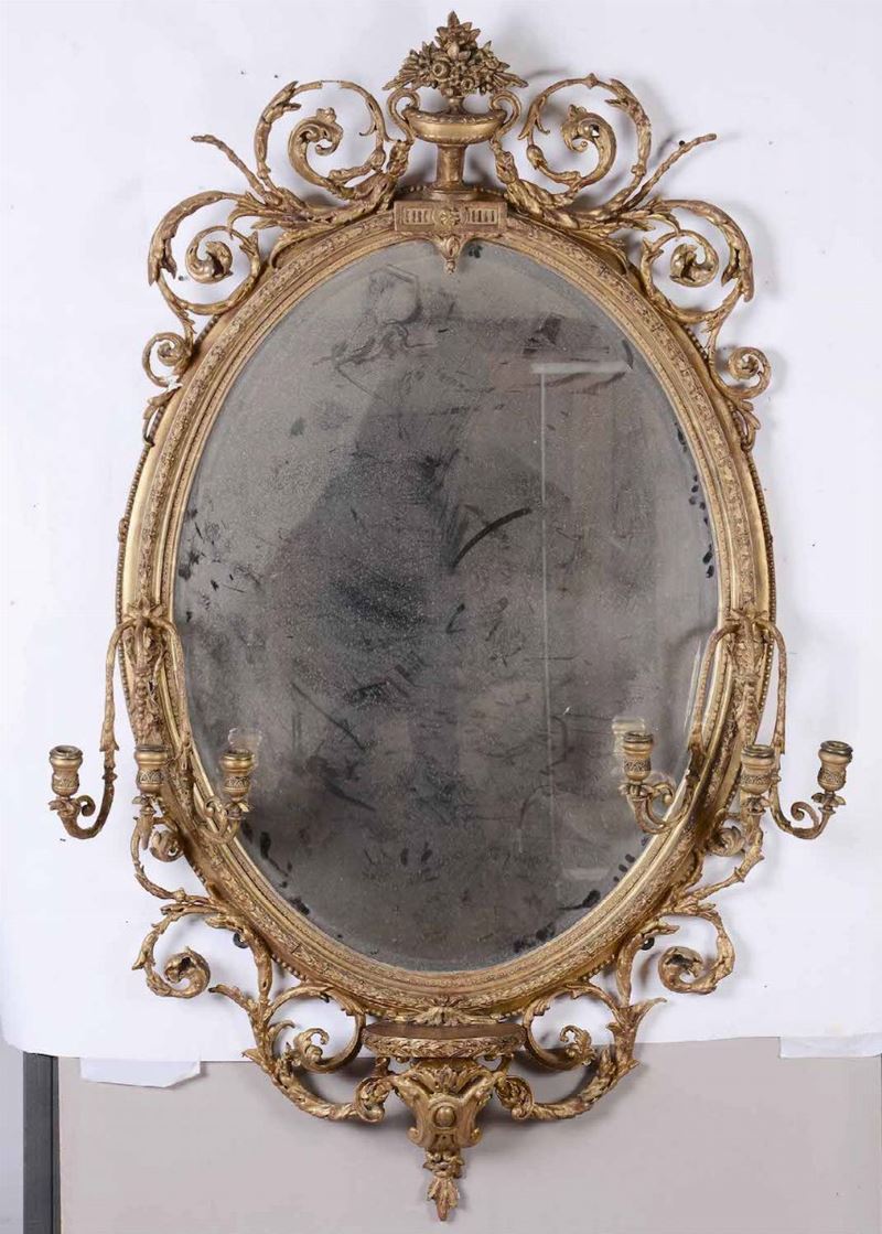 Specchiera ovale in legno intagliato e dorato, XIX secolo  - Asta Antiquariato I - Asta a Tempo - Cambi Casa d'Aste