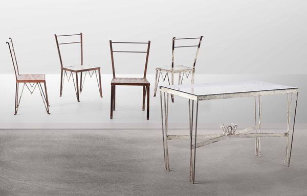 Set da giardino con tavolo rettangolare e quattro sedie in metallo laccato, metallo traforato e piano in cristallo molato.
