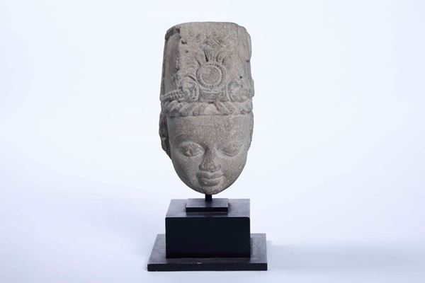 A stone head of a Hindu god, India, 900s