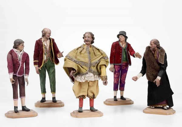Gruppo di cinque figure da presepe. Legno policromo e stoffa. Genova (?) XIX secolo