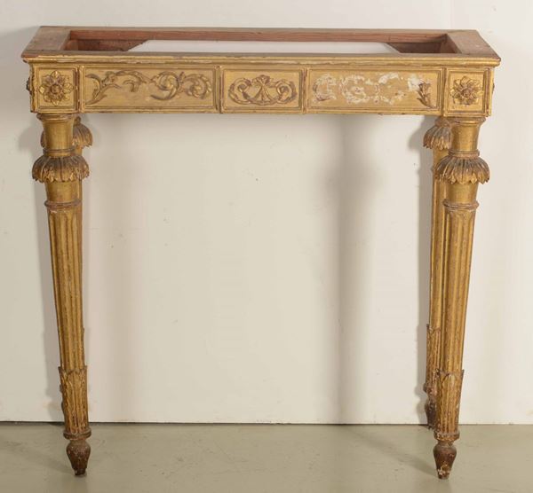 Consolle con specchiera in legno intagliato e dorato. XIX secolo
