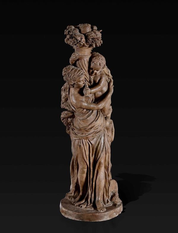 Gruppo allegorico in terracotta raffigurante baccante che sorregge giovane satiro nell'atto di tenere una cornucopia.  Francia XIX-XX secolo