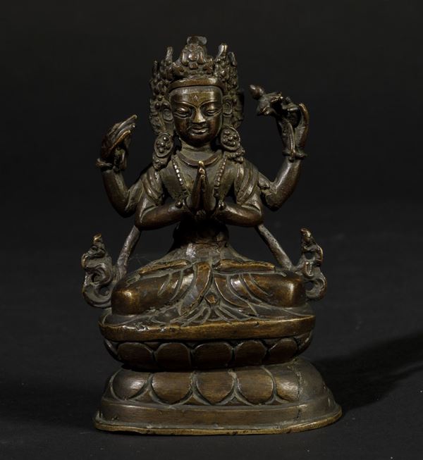 Figura di Avalokitesvara seduta su doppio fiore di loto in bronzo, Tibet, XIX secolo