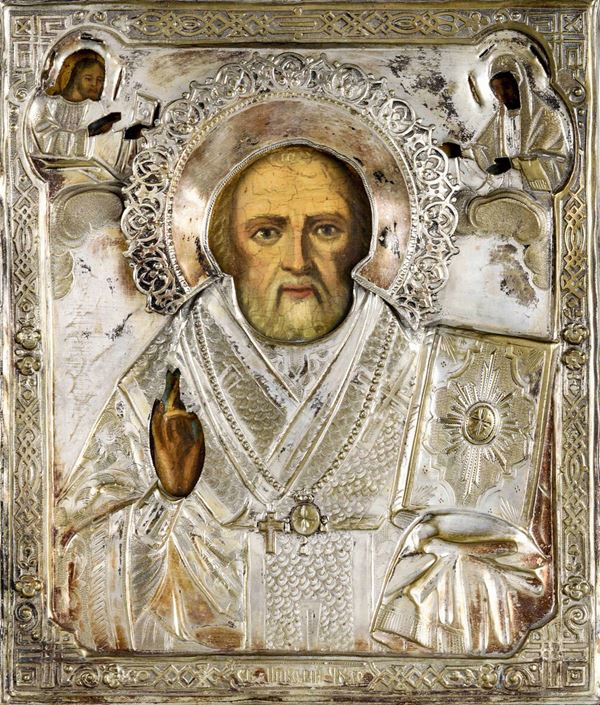 Icona con riza in argento sbalzato e cesellato raffigurante San Nicola. Russia XIX-XX secolo