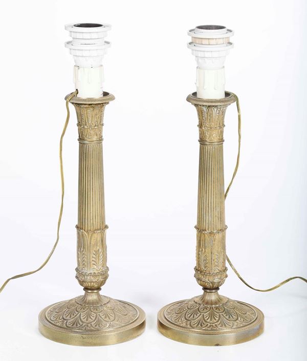 Coppia di candelieri in bronzo dorato. Carlo X