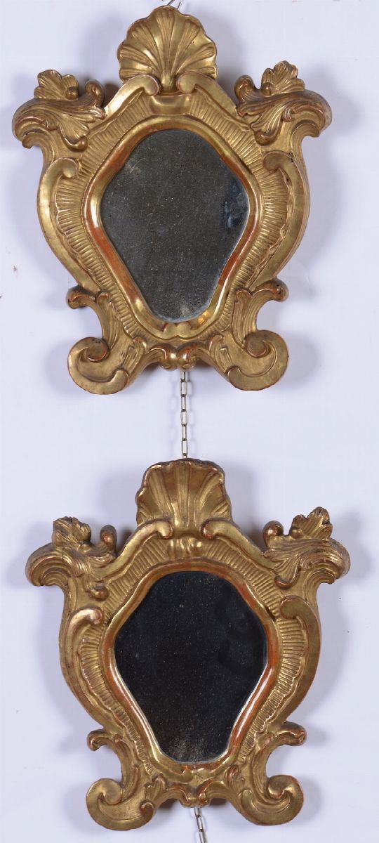 Coppia di specchiere in legno intagliato e dorato, XX secolo