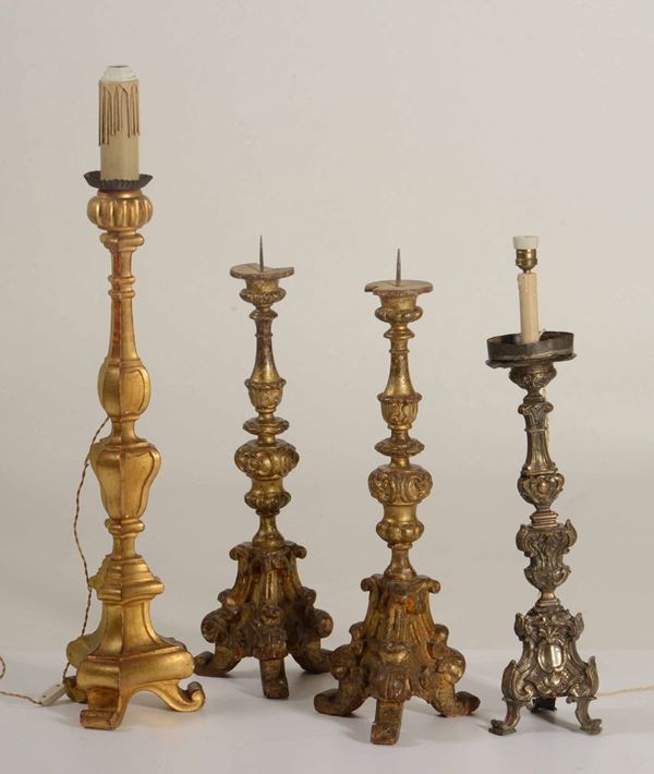 Lotto composto da quattro antichi candelieri