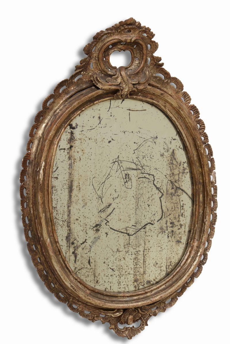 Specchiera ovale intagliata con cimasa, XIX secolo  - Asta Opere e Arredi da Dimore Lombarde - Cambi Casa d'Aste
