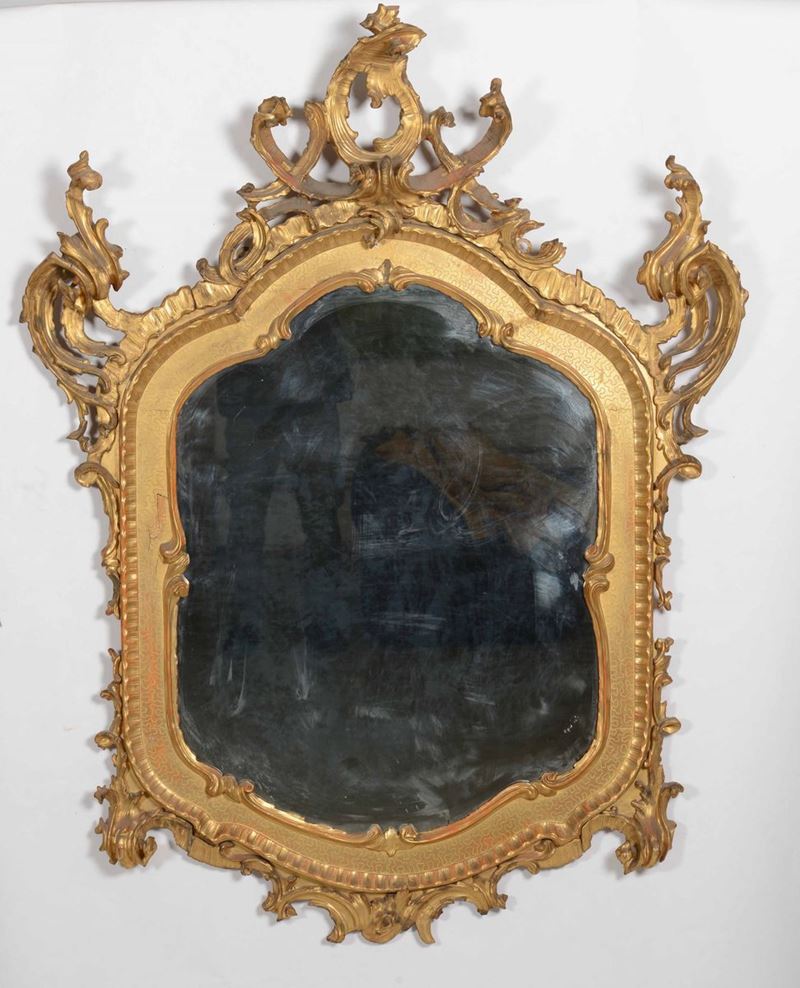  Specchiera in legno dorato ad ampi decori rocailles, XIX secolo  - Asta Opere e Arredi da Dimore Lombarde - Cambi Casa d'Aste