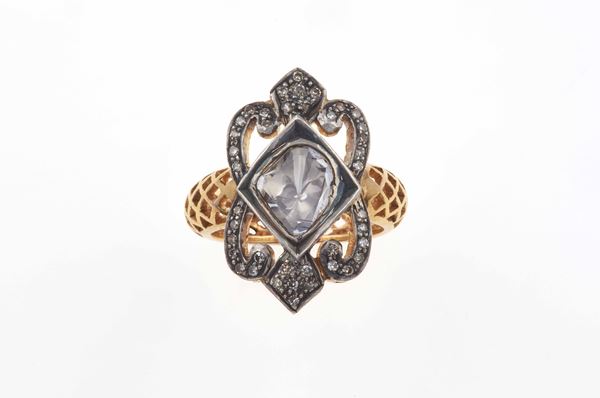Flat-cut diamond, gold and silver ring